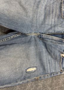 Distressed Blue Denim Jeans