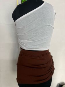 white top and brown skirt