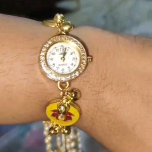 Elegant Gold Watch with Charms