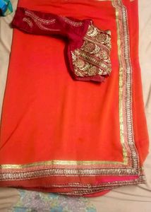 Stunning Orange Saree with Embroidered Blouse