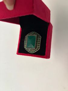 Elegant Green Stone Ring in Red Box