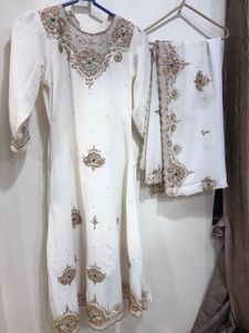 Elegant White Kurta Set with Intricate Embroidery