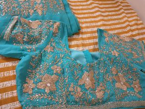 Turquoise Saree with Gold Embellishments