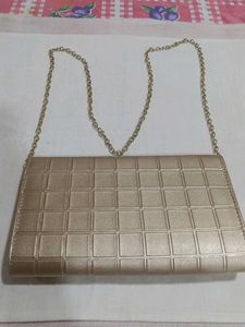 Mochi Gold Textured Clutch Bag