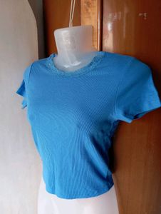 Blue Ribbed Lettuce Hem Top