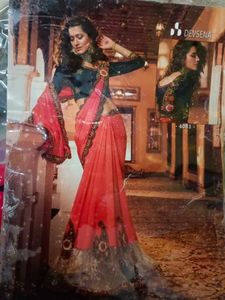 Vibrant Orange Saree with Intricate Embroidery