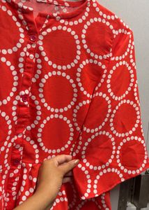 Vibrant Red Peplum Top with Circles