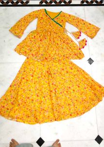 Yellow Floral Lehenga Choli with Pom-Pom Tassels