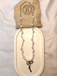 Elegant Pearl Necklace with Bow Charm