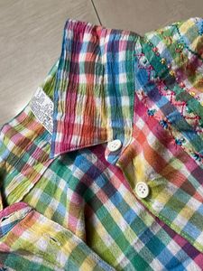 multicoloured shirt with a tie knot