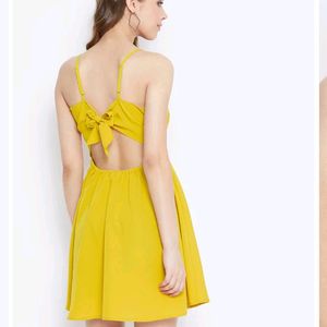 Today's Offer ₹150 Berrylush Women Solid Yellow Front Twist Knot Fit &amp; Flare Mini Dress For Women (Mustard Colour)