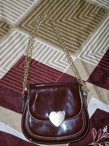Brown color , heartshape lock medium si