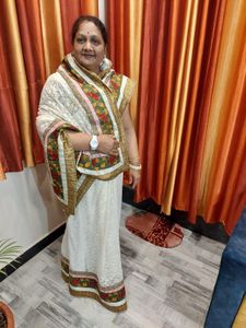 Elegant Off-White Saree with Floral Border