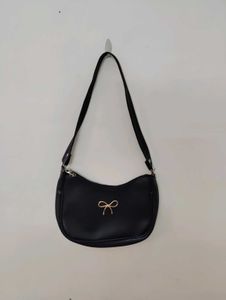 Chic Black Shoulder Bag with Bow Accent