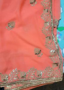 Elegant Coral Saree with Golden Embroidery