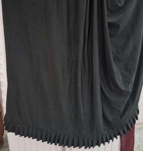 Selling a black color partywear stitched saree