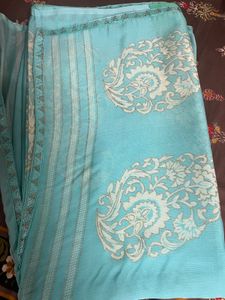 Elegant Teal Saree with Intricate Design
