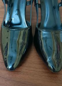 Black pointed heels with adjustable band