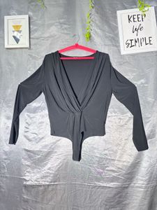 Chic Black Plunge Neck Bodysuit