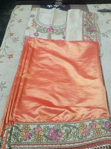 Elegant Unstitched Golden Blouse & Orange Saree