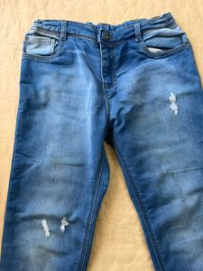Distressed Blue Denim Jeans