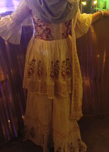 cream colour gharara and top with dupatta