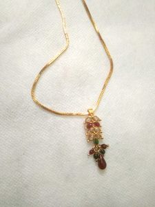 golden chain with ruby pendent