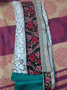 Elegant Teal Saree with Intricate Border