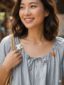 Chic Grey Blouse with Floral Embellishments