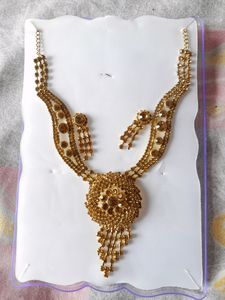 gold colour necklace and earring set in pack