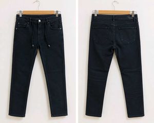 Selling a pair of women's black high-waist skinny