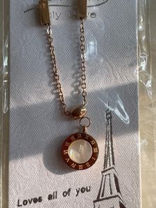 Stainless Steel And Mother Of Pearl Roman Numbers Pendant