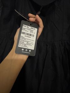 Chic Black Midi Dress with Floral Detail
