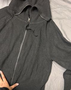 Black Knit Zip-Up Jacket with a high collar. (M/L)
