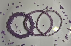 purple bracelet stack