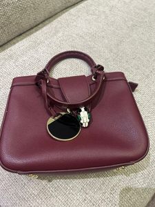 BVLGARI Chic Maroon Handbag with Snake Charm