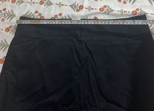 Chic Black Skirt with Embroidered Hem