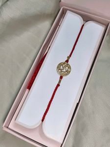 Designer silver  Swastik Rakhi with Stones