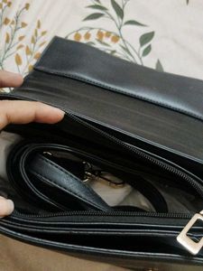 Chic Black Handbag with Buckle Detail