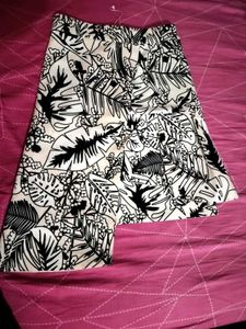 It is characterized by its bold black and white tr