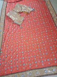 Stunning Orange Embellished Saree