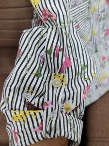 A striped black and white floral shirt.