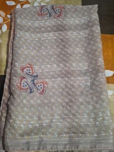 Elegant Beige Saree with Intricate Pattern