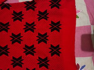 Red Knit Sweater with Black Geometric Pattern