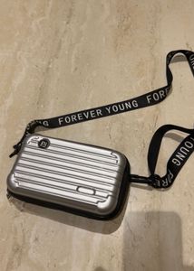 Convertible Silver Mini Luggage Style Clutch.