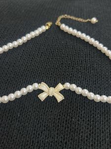 Elegant Pearl Choker Necklace with Bow