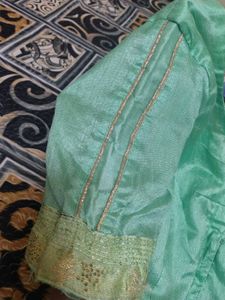 Elegant Teal Saree with Gold Stripes