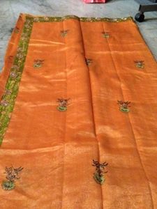 Elegant Orange Saree with Floral Print