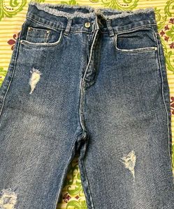 Distressed Blue Denim Jeans