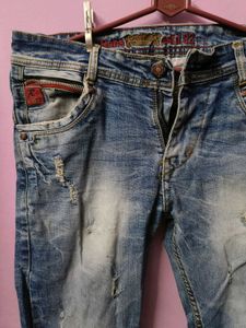 Distressed Blue Denim Jeans